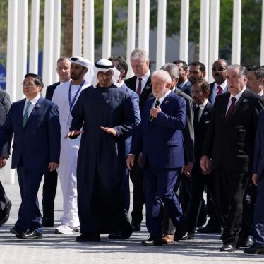 United Nations Secretary-General Antonio Guterres, left, and Brazil President Luiz Inacio Lula da Silva, center, walk with other dignitaries after posing for a group photo at the COP28 U.N. Climate Summit in Dubai, United Arab Emirates, December 1, 2023.