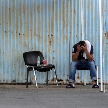 A man who was rescued at sea off the coast of Greece after the boat he and hundreds of other migrants and asylum seekers were on capsized sits at a shelter at the port of Kalamata, Greece, June 15, 2023.