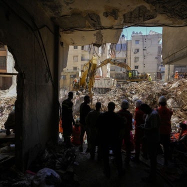 Emergency workers use excavators to clear the rubble at the site of an Israeli strike in Beirut’s southern suburbs, Lebanon, September 23, 2024