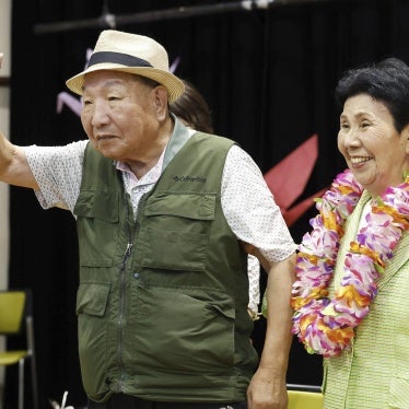 Iwao Hakamata waves to supporters while meeting with his sister Hideko, several weeks after his acquittal on retrial for the 1966 murder of a family of four, in Shizuoka, Japan, October 14, 2024.