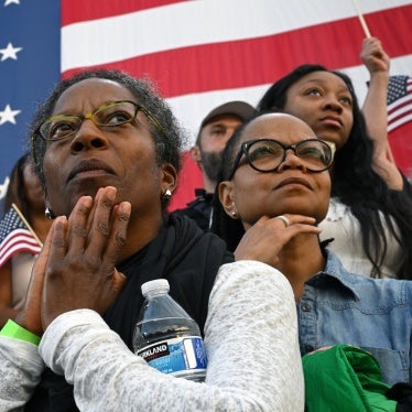 Supporters listen as Vice President Kamala Harris concedes the election