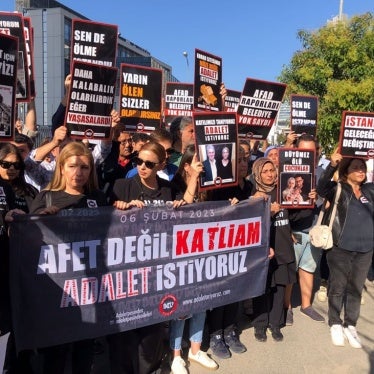 At an October 7, 2024 protest organized by the Families in Pursuit of Justice Platform, founded by those who lost their loved ones in the February 6, 2023 earthquakes, members hold a banner that reads, “Not a disaster but a massacre. We demand justice.”