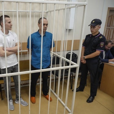 Former lawyers for Navalny,  Igor Sergunin (left), Alexei Liptser (center), and Vadim Kobzev, in the cage during a court session in Petushki, Vladimir region, Russia, September 12, 2024.