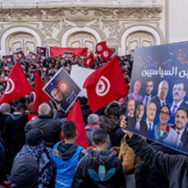 Protesters stand in square in Tunisia. 