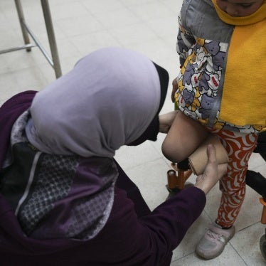 A doctor adjusts the cover on the amputated leg of a 5-year-old Palestinian girl at the Artificial Limbs and Polio Center in Gaza City, February 26, 2025. 