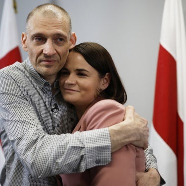 Belarusian opposition politician Syarhei Tsikhanouski (L), released from prison, embraces his wife, opposition leader Sviatlana Tsikhanouskaya, after a news conference in Vilnius, Lithuania, June 22, 2025. 