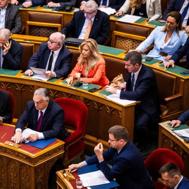 Hungarian Prime Minister Viktor Orban (bottom - C) and Deputy Prime Minister Zsolt Semjen (bottom L) attend the vote to start the withdrawal process from the International Criminal Court (ICC) in Budapest, Hungary, May 20, 2025.