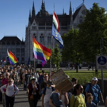Hungarians march in downtown Budapest to protest against a new law banning LGBTQ+ Pride events and the populist government's restriction on assembly rights, May 1, 2025.