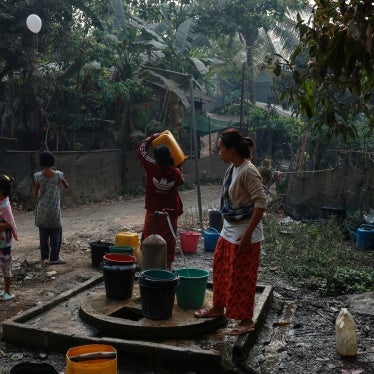 Refugees collect water at Mae La refugee camp in Thailand