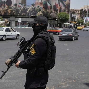 A member of Iran's security forces stands guard at Enqelab square in downtown Tehran, Iran, June 24, 2025.