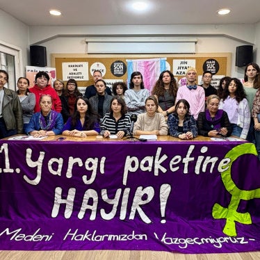 Activists hold a banner reading “No to the 11th Judicial Package” in Turkish at a press conference in Istanbul on October 28, 2025 against the leaked 11th Judicial Reform containing provisions targeting LGBT people. 