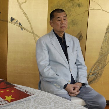 Jimmy Lai with a copy of Apple Daily's July 1, 2020, edition in Hong Kong. 