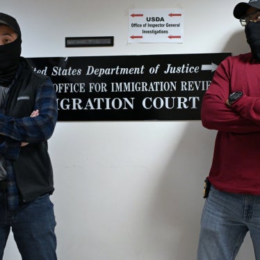 Masked US federal agents outside the immigration court in Manhattan's 26 Federal Plaza, New York City, October 31, 2025.