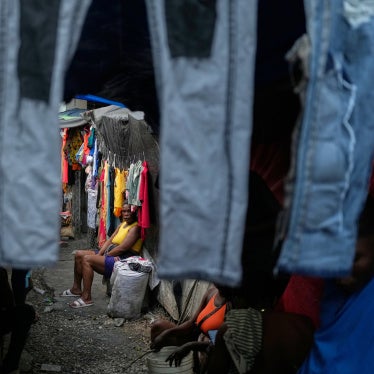 A woman sits in a shelter for families displaced by criminal group violence in Port-au-Prince, Haiti, October 14, 2025.