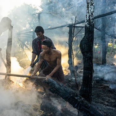 Villagers extinguish a fire that engulfed a house after a Myanmar military airstrike, Tabayin, Myanmar, November 13, 2025.