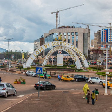 Cars drive through an intersection near a monument in Yaoundé, Cameroon, September12, 2025. 