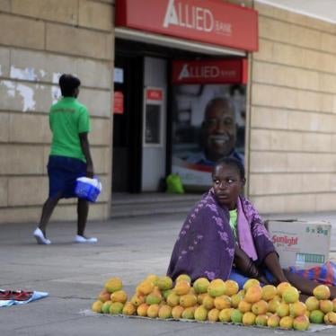 A Zimbabwean fruit vendor waits for customers in central Harare on January 9, 2015. 
