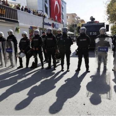 Riot police stand guard outside the Kanalturk and Bugun TV building in Istanbul, 28 October 2015