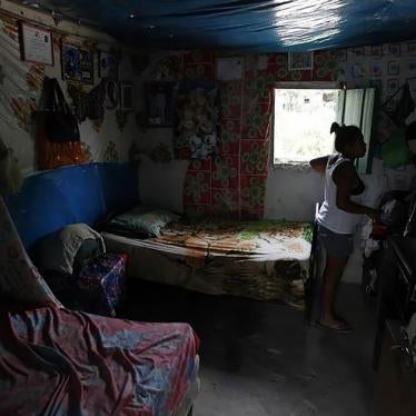 A woman, who is planning to travel without documents to the United States, in her home in the village of Suyatal, outside Tegucigalpa, Honduras, on June 25, 2014. 