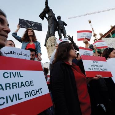 Activists hold placards during a protest demanding civil marriage in Lebanon. There is currently no Lebanese civil personal status law.