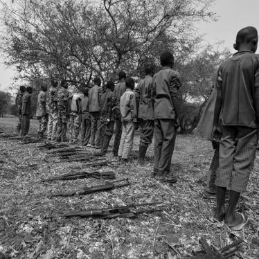 Child soldiers put down their guns in a disarmament and release ceremony in Jonglei state, South Sudan, February 10, 2015. 