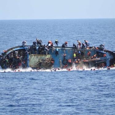Migrants are seen on a capsizing boat before a rescue operation by Italian navy ships "Bettica" and "Bergamini" off the coast of Libya in this handout picture released by the Italian Marina Militare on May 25, 2016. 