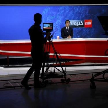 A cameraman films a news anchor at Tolo TV studio in Kabul, Afghanistan on October 18, 2015.