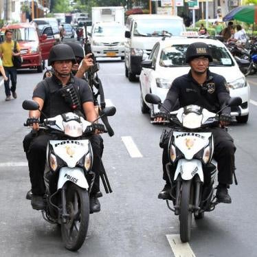 Members of the Philippine National Police (PNP) Special Weapons And Tactics (SWAT) patrol along a main street of metro Manila in the Philippines May 12, 2016.