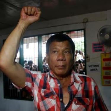 Rodrigo Duterte raises a clenched fist before casting his vote for national elections in Davao city, Philippines on May 9, 2016.