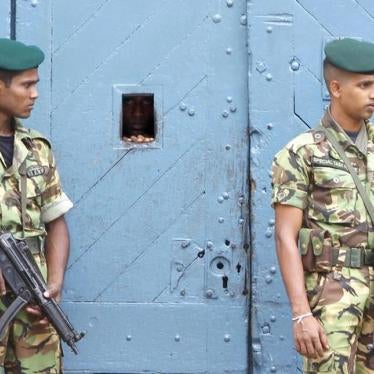 Special task force police officers stand guard outside a jail in Colombo on November 7, 2010.