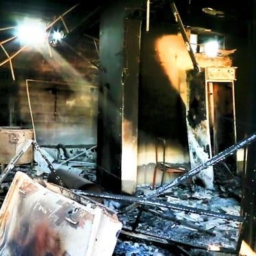 © 2014 Human Rights Watch Militias looted and set on fire homes and local businesses in the village of Yengija, Iraq, in late September 2014. 