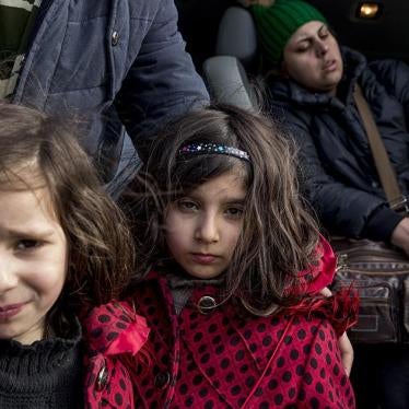  Two young Iranian sisters at the Idomeni border crossing between Greece and Macedonia.  January 26, 2016.