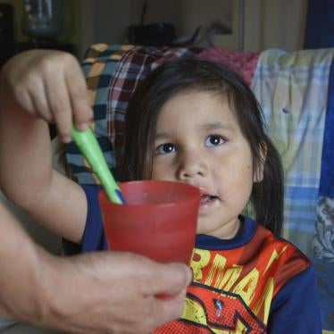 A child in Grassy Narrows First Nation, Ontario, Canada brushes her teeth with bottled water. Water on First Nations reserves is contaminated, inadequately treated or hard to access. April 14, 2016. Video Still (c) 2016 Human Rights Watch
