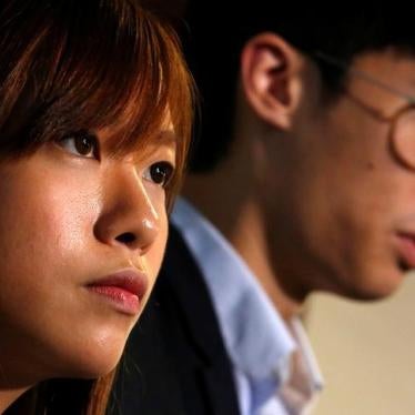 Pro-independence legislator elects Yau Wai-ching (L) and Baggio Leung react as they meet reporters inside Legislative Council in Hong Kong, China November 4, 2016. 
