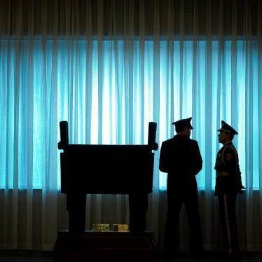 People’s Liberation Army officers stand in front of a window before a welcome ceremony for U.S. Army Chief of Staff General Mark Milley at the Bayi Building in Beijing, August 16, 2016.