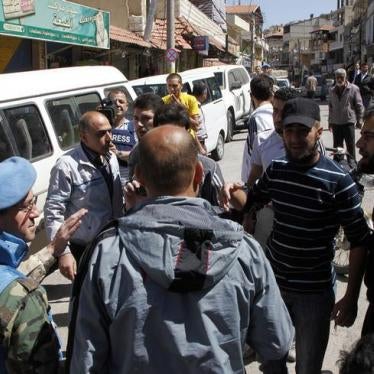 United Nations observers talk with local residents during a field visit to the Madaya area, near Damascus May 6, 2012. 