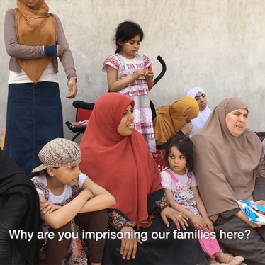 Families of detainees in Egypt's Scorpion Prison gather near the prison walls to protest lack of visits.