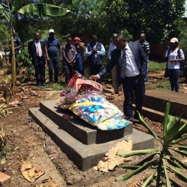 Mourners attend the funeral of Emmanuel Arituha, a security guard killed by assailants in an attack on the Ugandan non-governmental organization Human Rights Awareness and Promotion Forum (HRAPF) in May 2016.