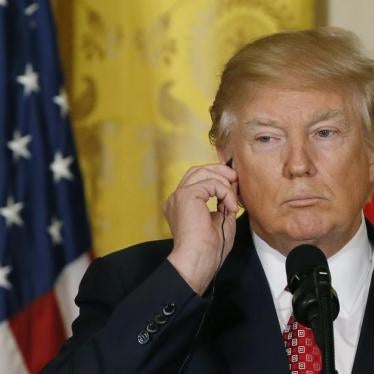 U.S. President Donald Trump holds his earpiece as he holds a joint press conference with Japanese Prime Minister Shinzo Abe (not pictured) at the White House in Washington, U.S., February 10, 2017.