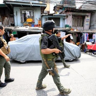 Members of the Philippine Drug Enforcement Agency (PDEA) operatives search the area during their anti-drug operaitons in Quezon city, metro Manila, Philippines March 16, 2017.
