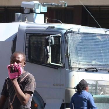 A man reacts to teargas fired by police at protesters calling for electoral reform in Harare, Zimbabwe, July 12, 2017.