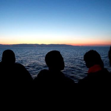 Migrants look at south Italy's coast as they approach on the Vos Hestia ship after being rescued by " Save the Children" crew on the Mediterranean sea off the Libya coast, June 20, 2017. 
