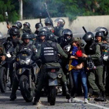 A demonstrator is detained by security forces during clashes at a protest against Venezuelan President Nicolas Maduro's government in Caracas, Venezuela, July 10, 2017. 