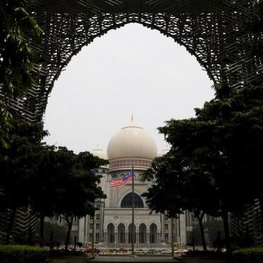 Malaysia's national flag flies in front of the Federal Court on a hazy day in Putrajaya, Malaysia, October 6, 2015.