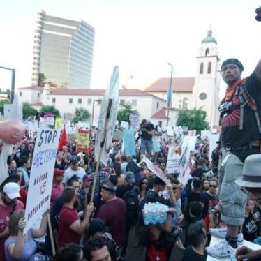 Peace activists rally outside of a Donald Trump campaign rally in Phoenix, Arizona, August 22, 2017. 