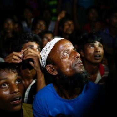 Rohingya refugees wait for food to be distributed by local organisations in Teknaf, Bangladesh on September 13, 2017. 