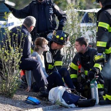 First responders aid a woman following the truck attack in Manhattan in New York City, October 31, 2017.