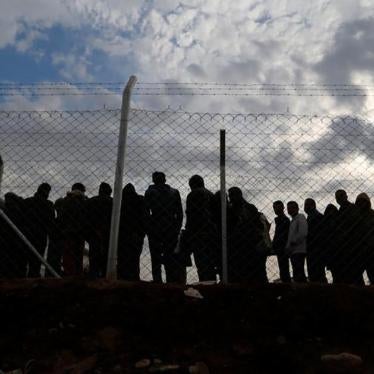 Displaced persons who fled fighting in Mosul gather at Khazir camp, in the Kurdistan Region of Iraq. 