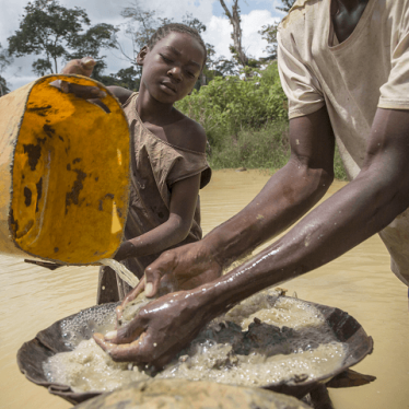 A girl works in an artisanal diamond mine in Sosso Nakombo, Central African Republic, near the border with Cameroon, in August 2015
