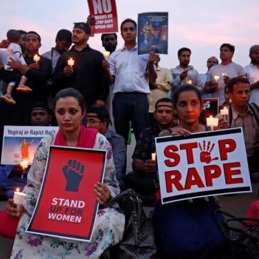 People hold a candlelight vigil in Bengaluru, India, to protest the rape of an 8-year-old girl in Kathua and a teenager in Unnao, April 13, 2018.